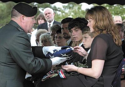  The widow and sons of fallen Army Captain Chris Cash, 36 (2004).