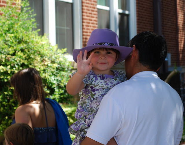 Little girl in a purple cowboy hat