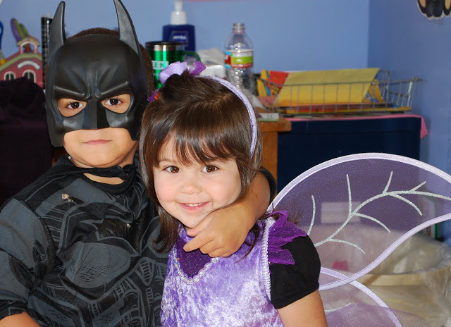 Boy in a Batman Costume and girl in a butterfly costume
