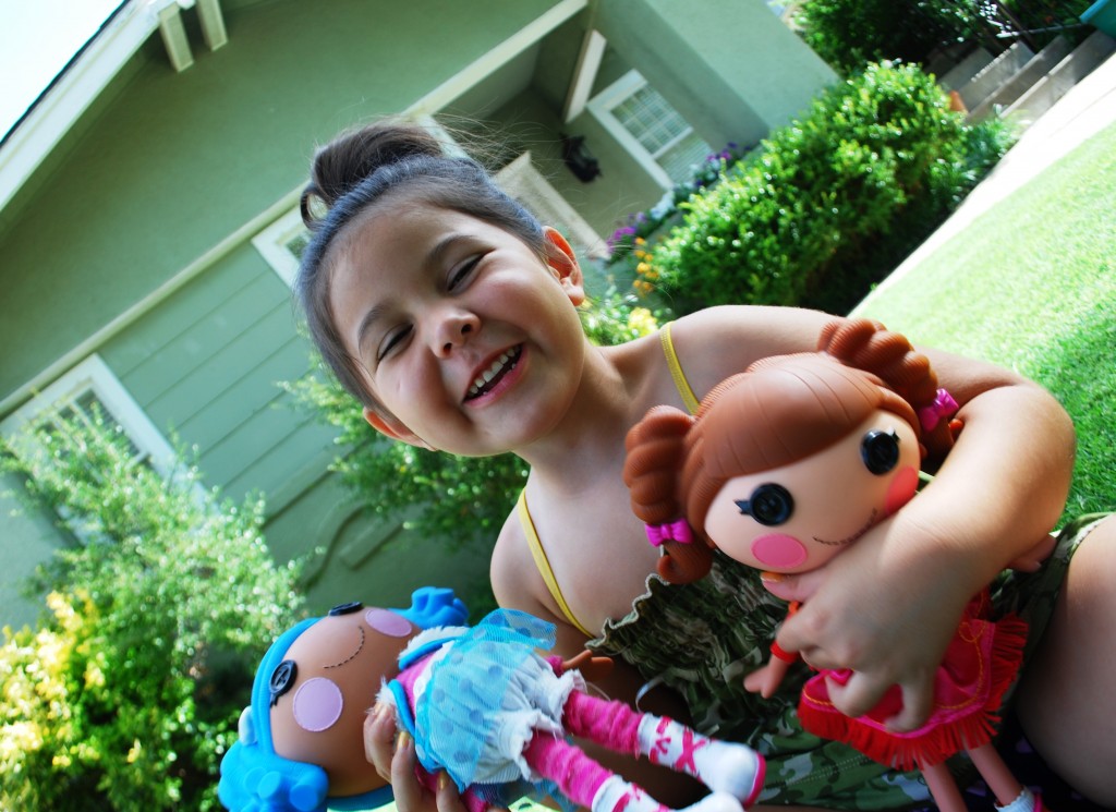 Girl with her Lalaloopsy Dolls
