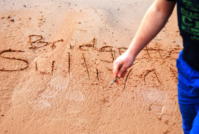 Names drawn in the sand