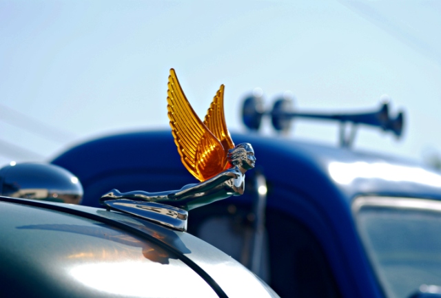 Hood Ornament Woman with Wings Flying through the air
